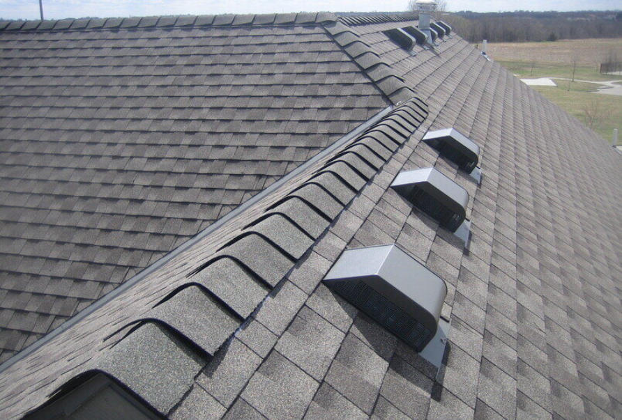 Roof maintenance plans in Kansas City – well-kept shingle roof with ridge vents